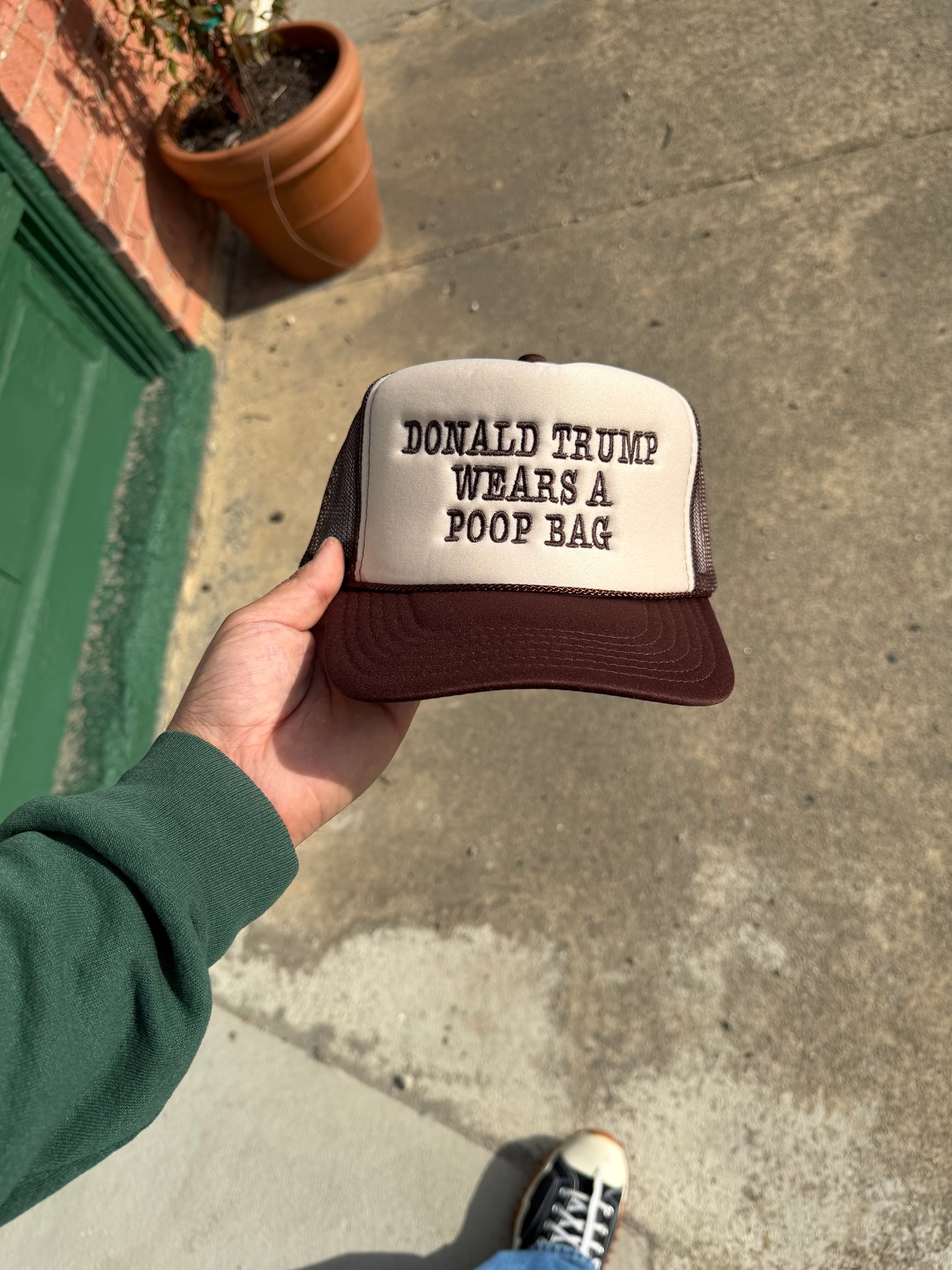 Donald Trump Wears A Poop Bag